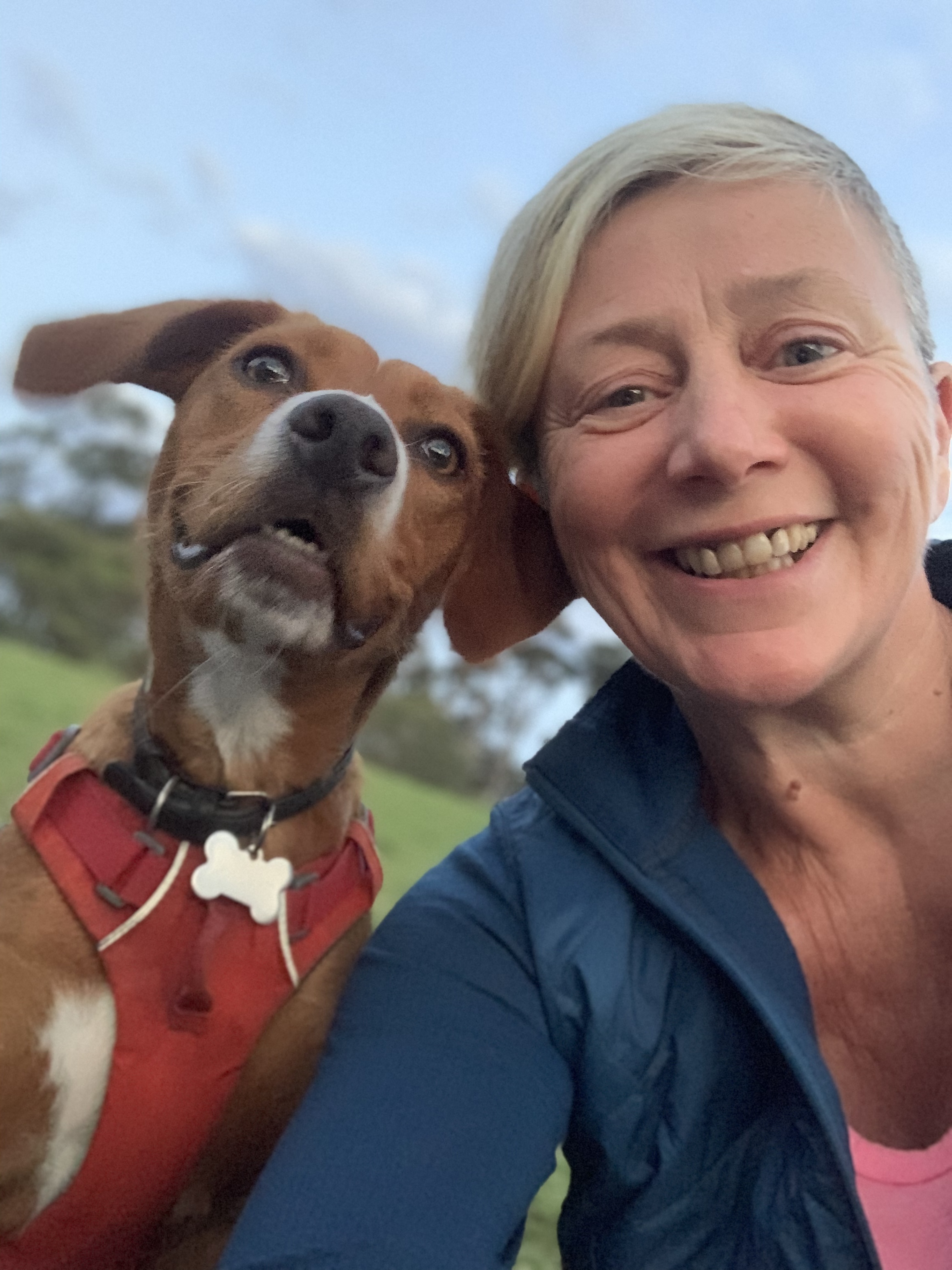 Jayne smiling beside Inca